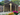 Wooden gazebo with flowers in a garden setting
